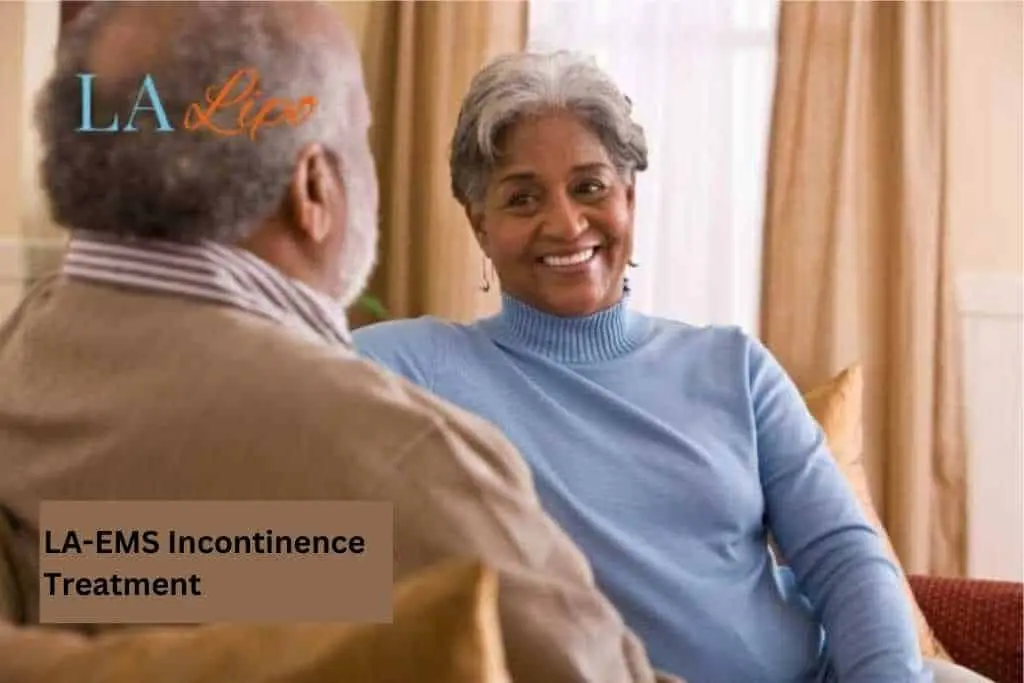 Couple sat smiling at each other - LA-EMS treatment Cambridge