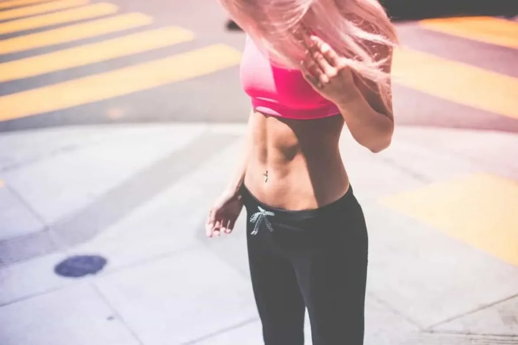 Woman with toned stomach after LA-EMS Body Sculpting Treatment Cambridge